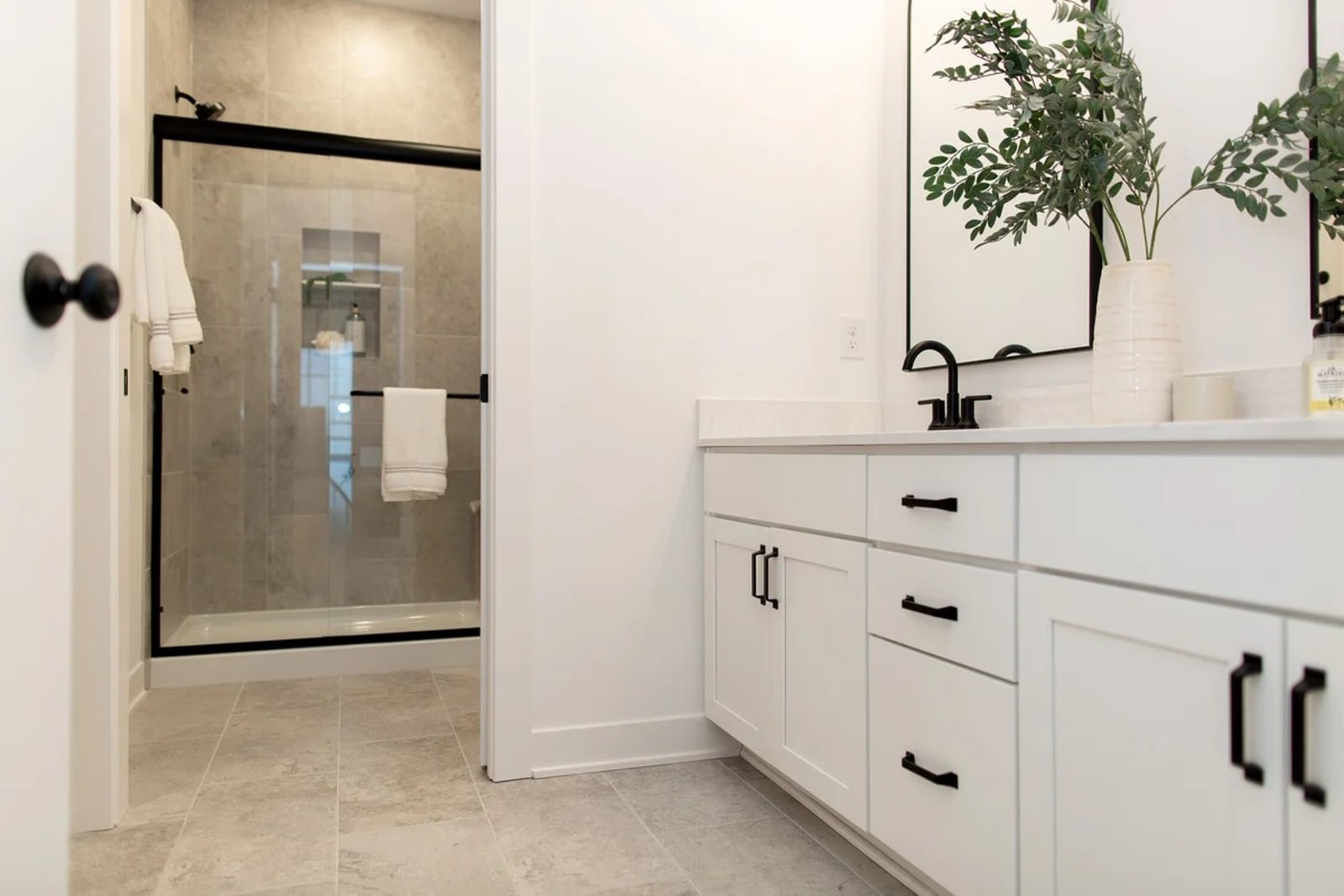 Finished bathroom showing the vanity and tiled wall detail
