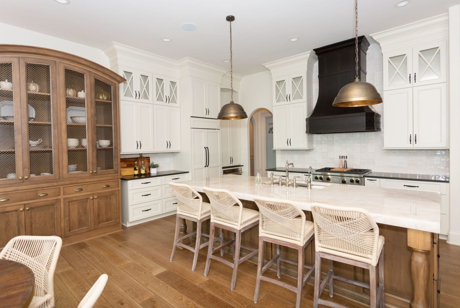 Designed kitchen with full-height cabinetry and a large work island
